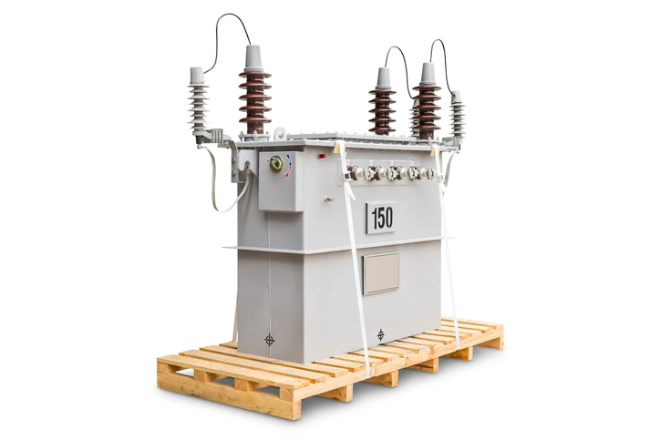 Electrical transformer on a wooden pallet, showcasing surge protection features for Kazar's Electric services.