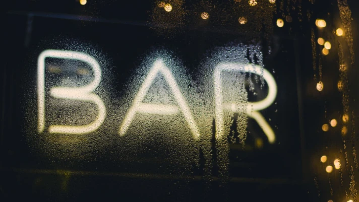 Emergency electrical services sign reading "BAR" with condensation, highlighting the importance of reliable power solutions during hurricane season.