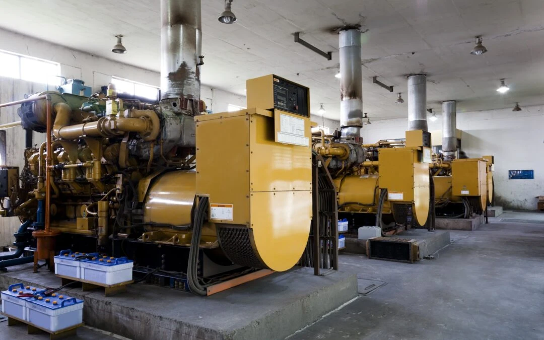 Industrial generators in Kazar's Electric facility, showcasing robust machinery for standby power solutions.