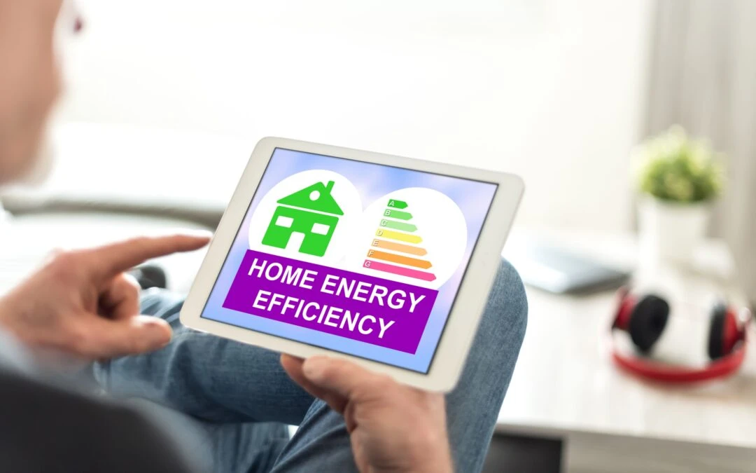 Person with a tablet showing energy efficiency graphics for Kazar's Electric, promoting sustainable appliances.