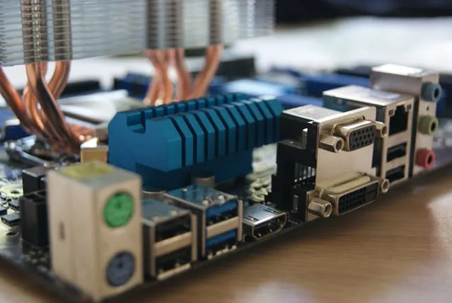Detailed motherboard with copper heat pipes, highlighting technology for Kazar's Electric electrical upgrade services.